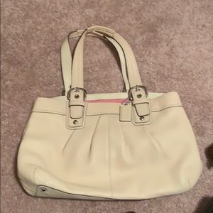 cream coach purse